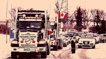Foto de pessoas em uma manifestação dentro de carros e caminhões, com bandeiras canadenses.